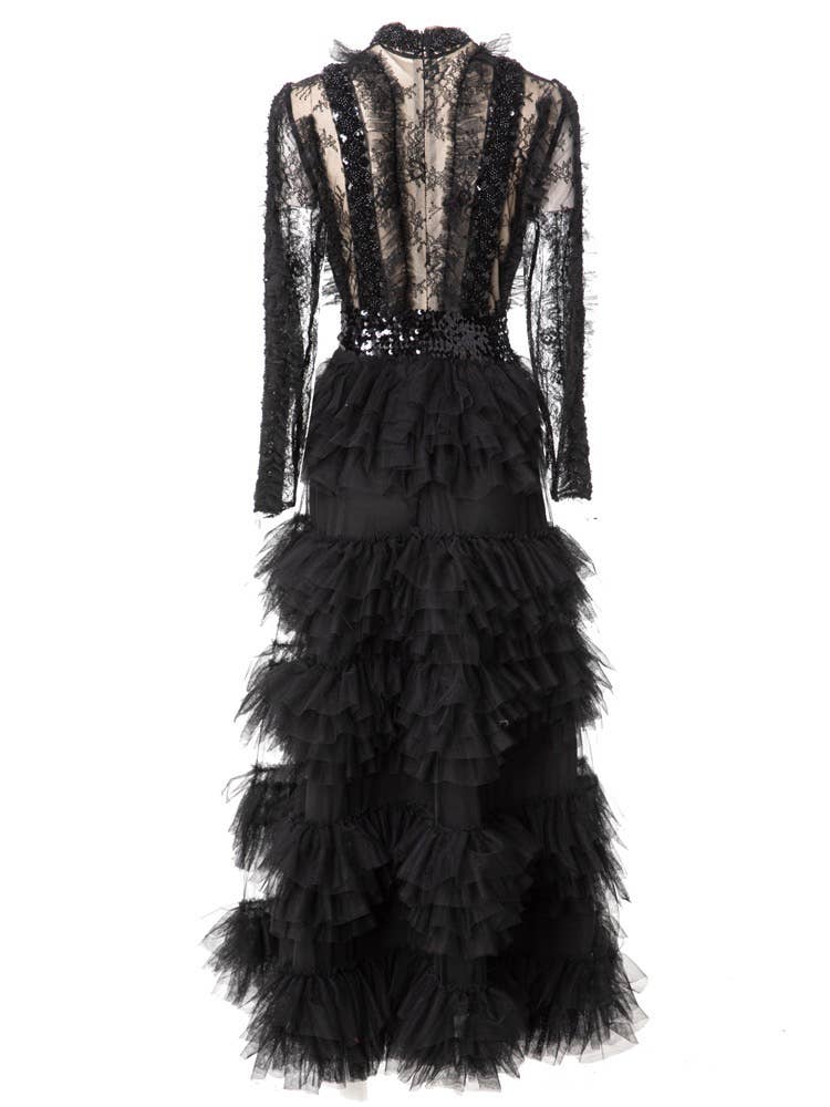 Black beaded and lace dress with ruffled layers on a white background