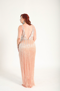 Beaded fringe gown with silver beading across the bodice and back of the gown. Bdead fringe hangs down elegantly. Zipper back.