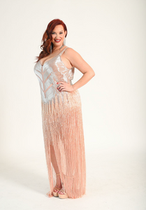 Beaded fringe gown with silver beading across the bodice and back of the gown. Bdead fringe hangs down elegantly. Zipper back.