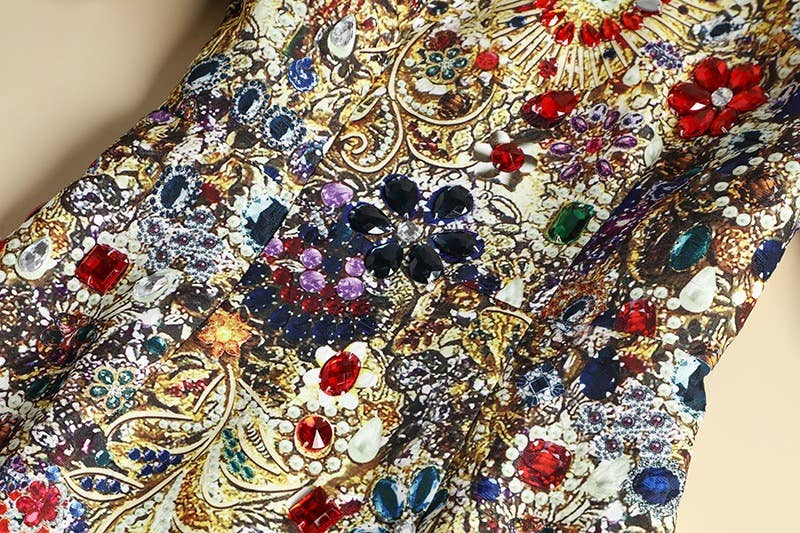 Close-up of the gemstone print fabric with intricate patterns and colorful gemstones.