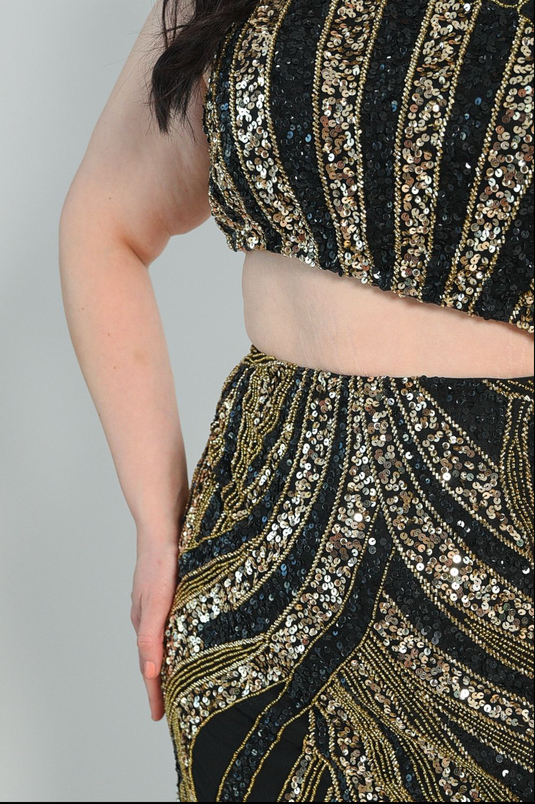 Beaded one-shoulder gown, high split. Side zipper. 