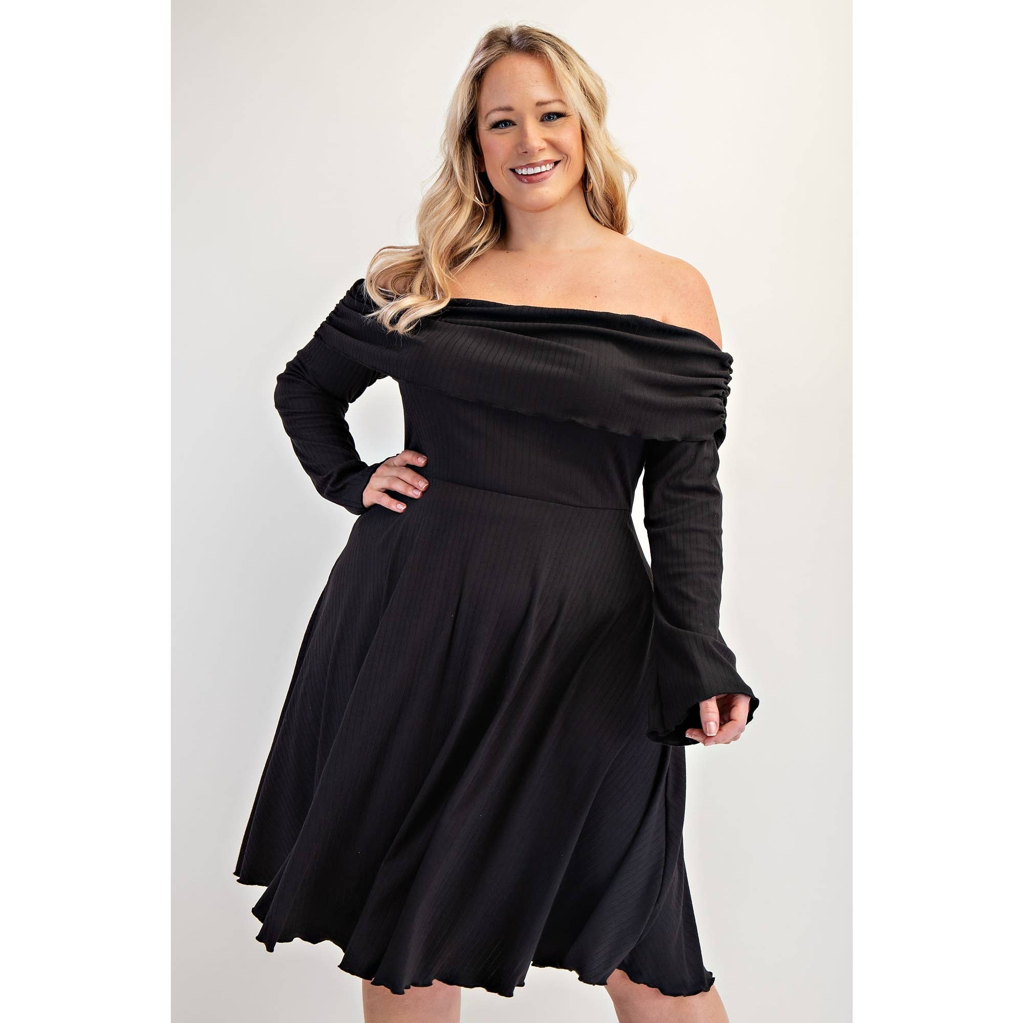 Woman wearing a black off-shoulder dress