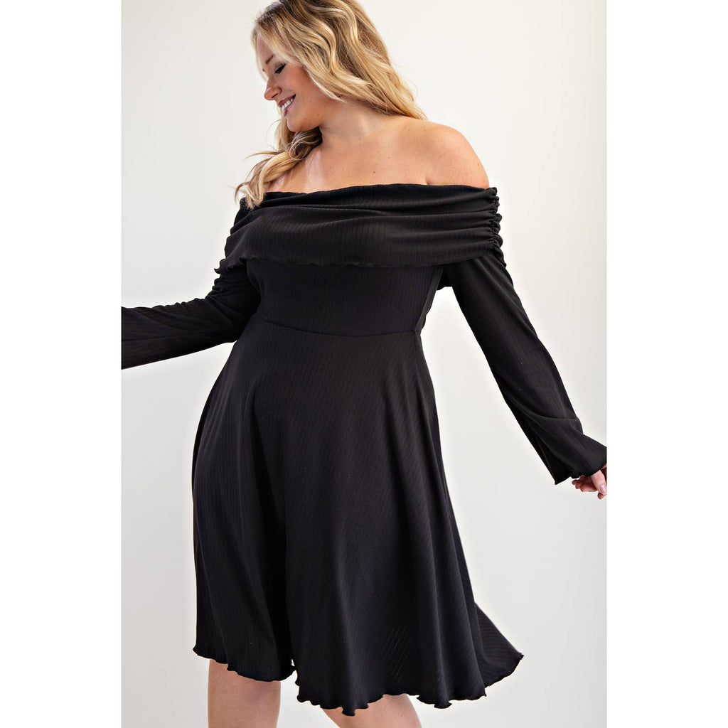 Woman wearing a black off-shoulder dress close up