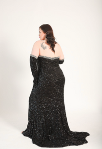 Strapless gown with crystal details. Sequin gloves with crystal accents. High split. Gown has a train. 
